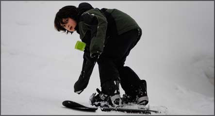 fifth grader snowboarding