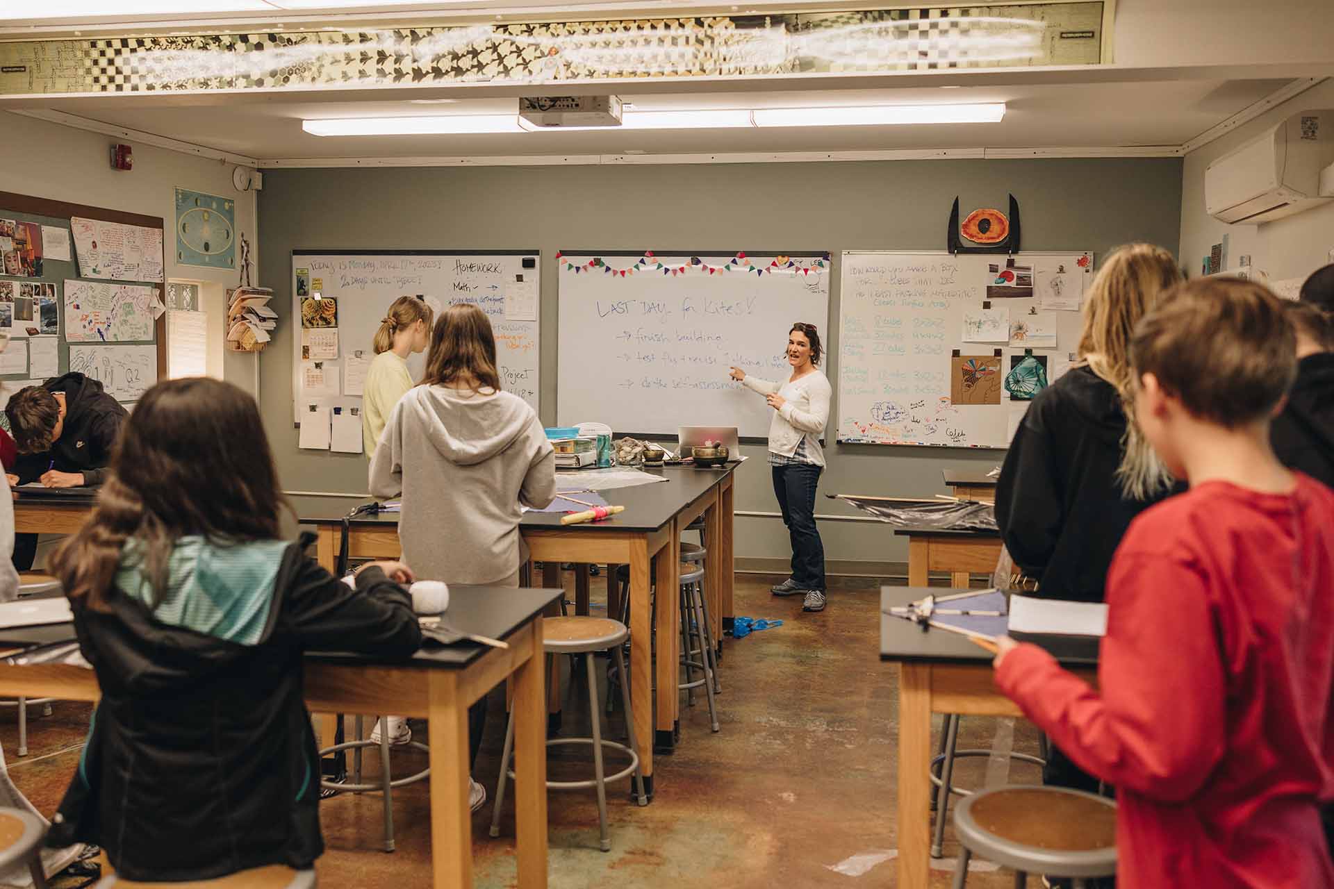 omega class schedule - a demonstration of a science class with students making kites