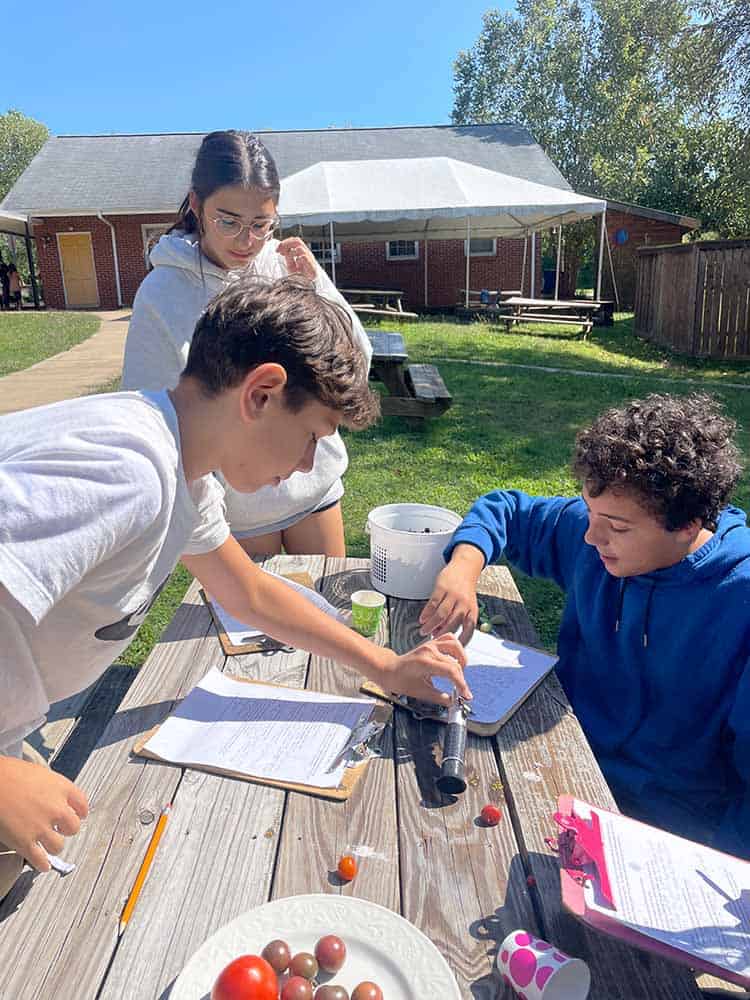 Know_Thyself Omega students in science lab