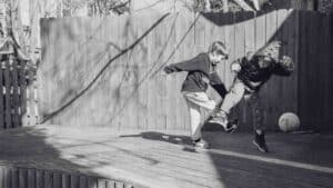 two children at recess playing ball on a brain break